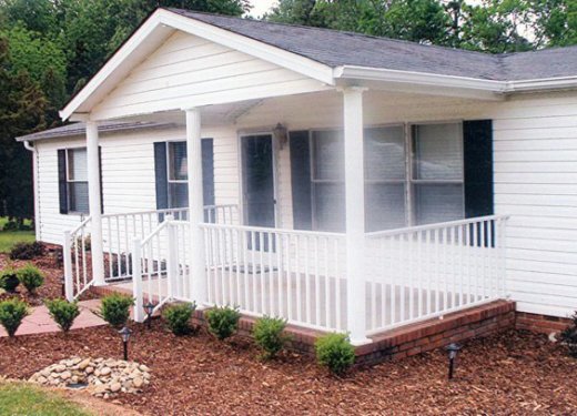 Gabled porch cover with white columns and handrails near Anderson, SC