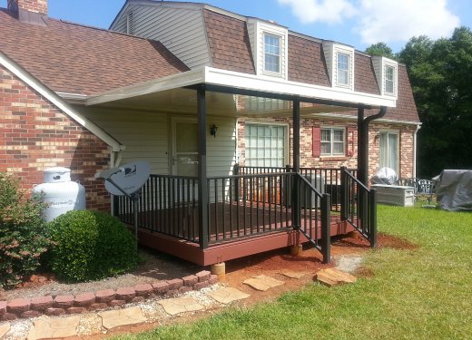 Ivory patio cover with bronze posts and rails near Simpsonville, SC