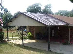 Bronze carport with filled gable in sandstone near Easley, SC.